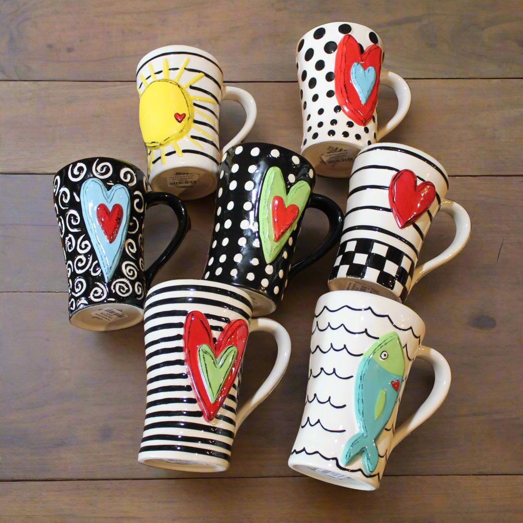 Unique, artful mugs with a cheery heart accent.