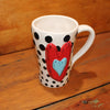 Unique, artful mugs with a cheery heart accent.