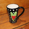 Unique, artful mugs with a cheery heart accent.