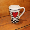 Unique, artful mugs with a cheery heart accent.