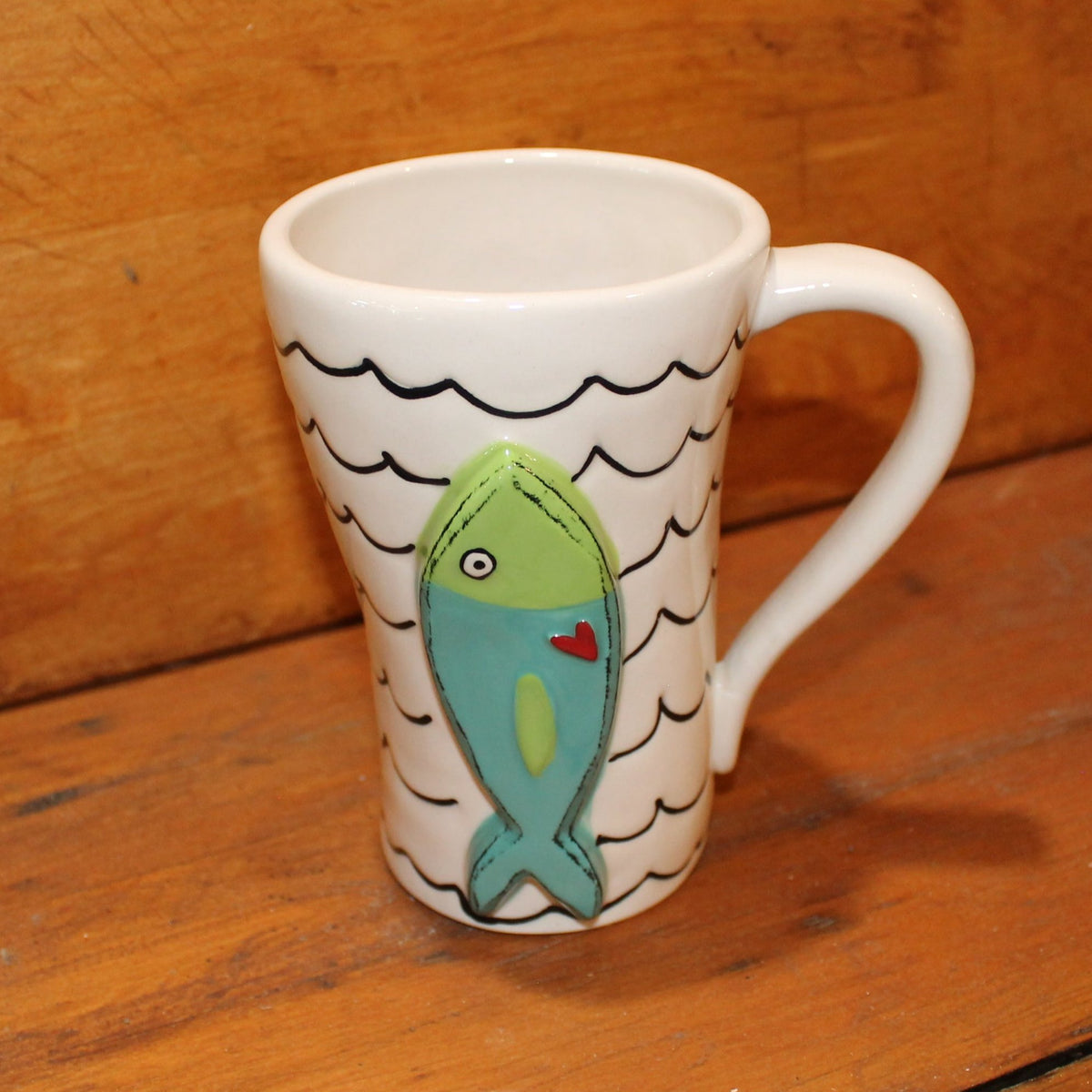 Unique, artful mugs with a cheery heart accent.