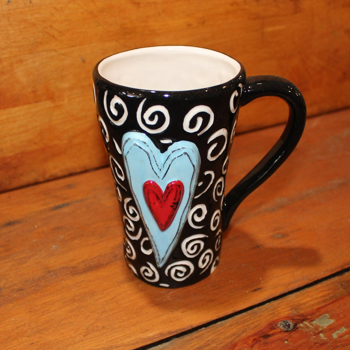 Unique, artful mugs with a cheery heart accent.