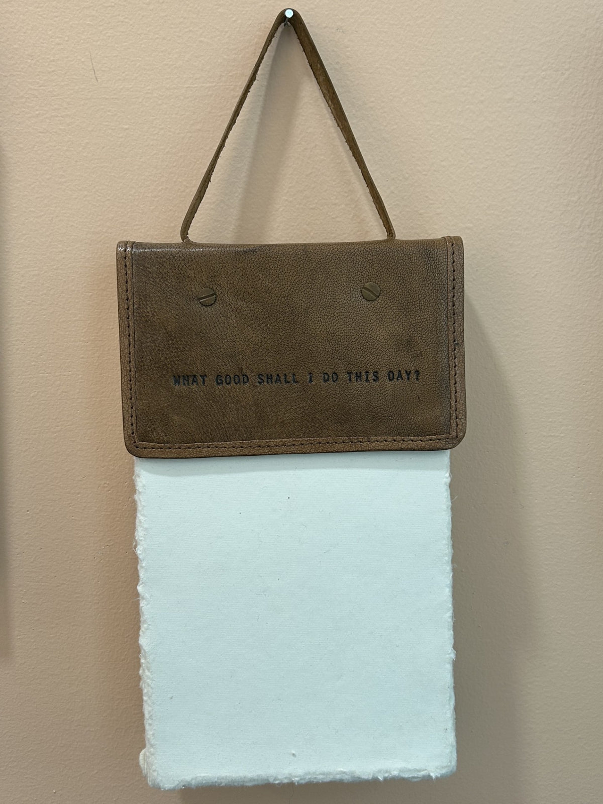 Leather bound artisan paper hanger