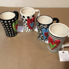 Unique, artful mugs with a cheery heart accent.